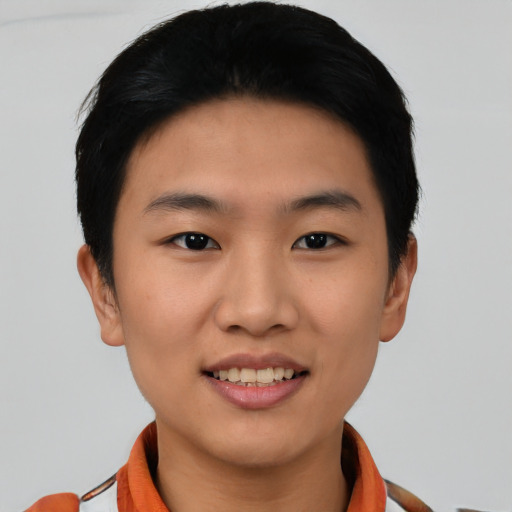 Joyful asian young-adult female with short  black hair and brown eyes