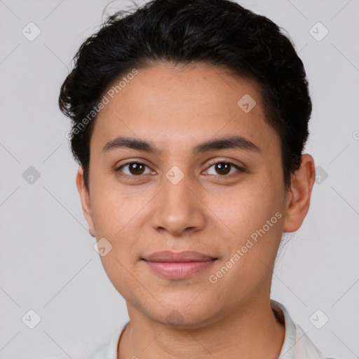 Joyful latino young-adult male with short  brown hair and brown eyes