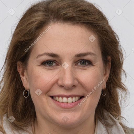 Joyful white adult female with medium  brown hair and grey eyes