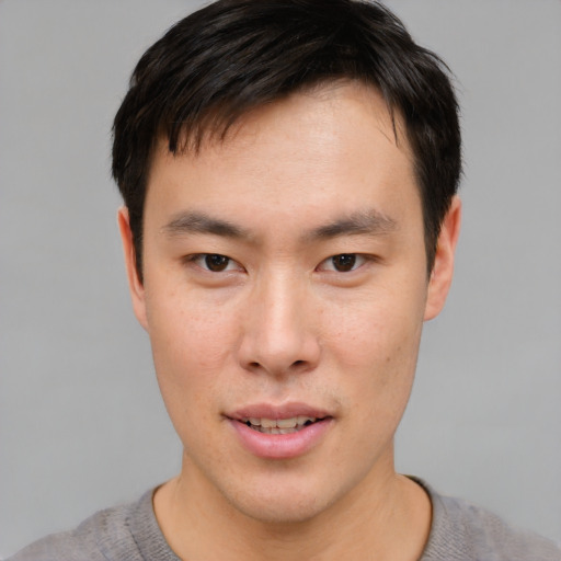 Neutral asian young-adult male with short  brown hair and brown eyes
