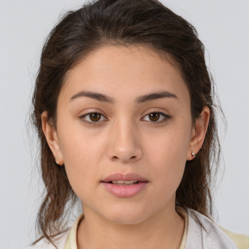 Joyful white young-adult female with medium  brown hair and brown eyes