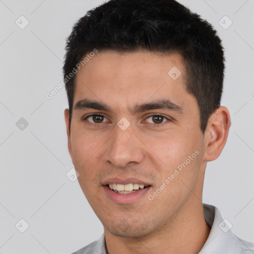 Joyful white young-adult male with short  black hair and brown eyes