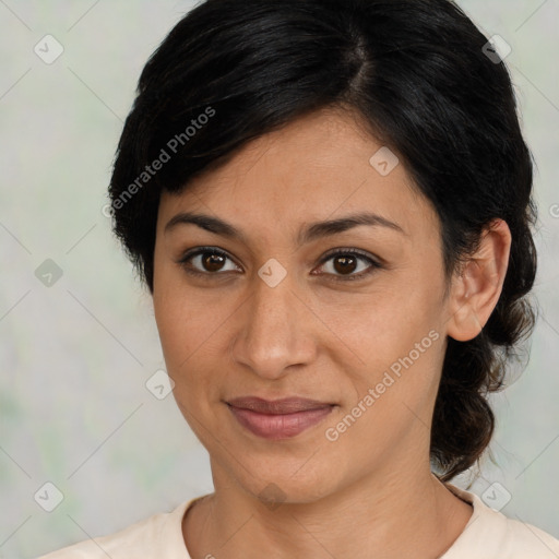 Joyful latino adult female with medium  brown hair and brown eyes