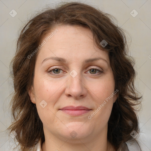 Joyful white adult female with medium  brown hair and grey eyes