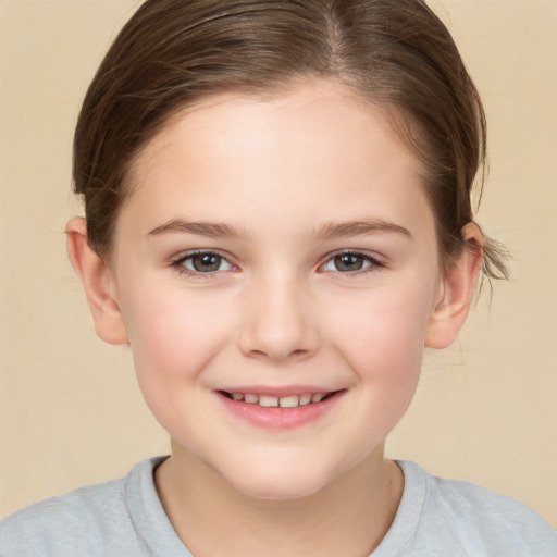 Joyful white child female with short  brown hair and brown eyes