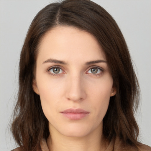 Neutral white young-adult female with medium  brown hair and brown eyes