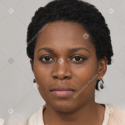 Neutral black young-adult female with short  black hair and brown eyes