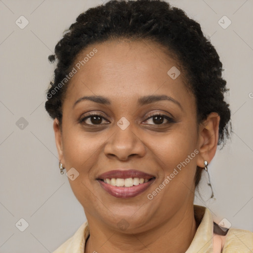 Joyful latino adult female with short  brown hair and brown eyes