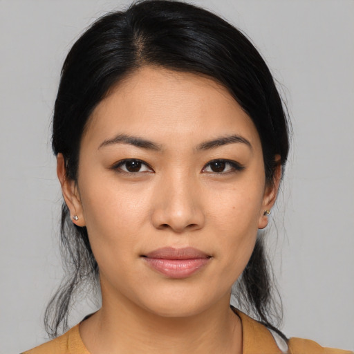 Joyful asian young-adult female with medium  black hair and brown eyes