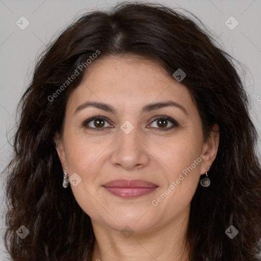 Joyful white adult female with long  brown hair and brown eyes