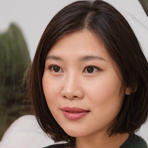 Neutral asian young-adult female with medium  brown hair and brown eyes