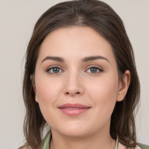 Joyful white young-adult female with medium  brown hair and brown eyes