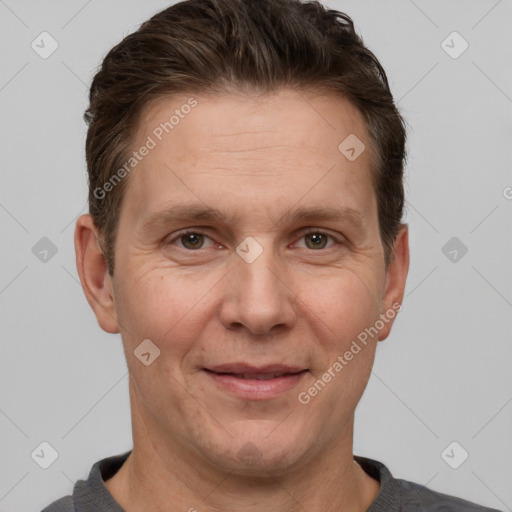 Joyful white adult male with short  brown hair and grey eyes