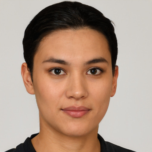 Joyful latino young-adult female with short  black hair and brown eyes