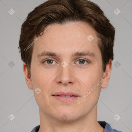 Joyful white adult male with short  brown hair and grey eyes