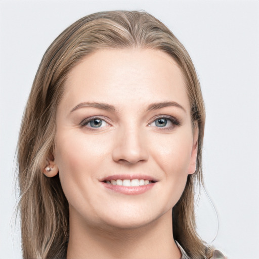 Joyful white young-adult female with long  brown hair and grey eyes