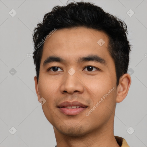 Joyful asian young-adult male with short  black hair and brown eyes