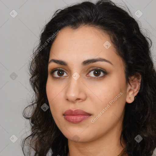 Joyful latino young-adult female with long  brown hair and brown eyes