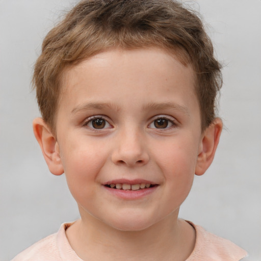 Joyful white child male with short  brown hair and brown eyes