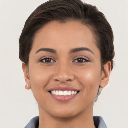 Joyful white young-adult female with short  brown hair and brown eyes