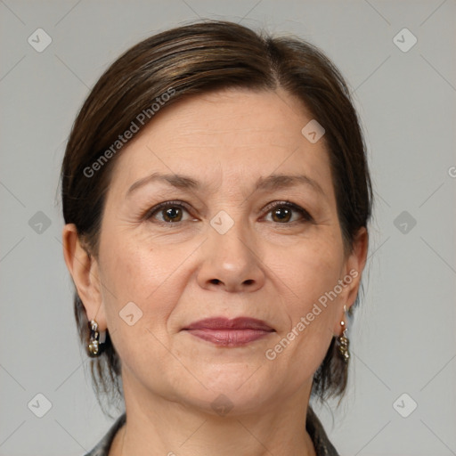 Joyful white adult female with medium  brown hair and brown eyes