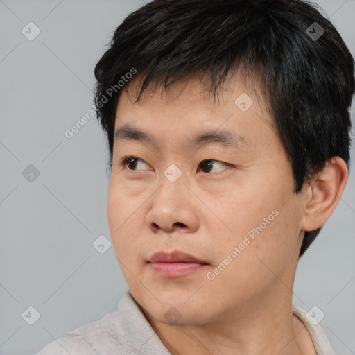 Neutral asian young-adult male with short  brown hair and brown eyes