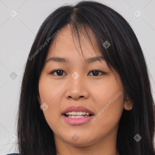 Joyful asian young-adult female with long  brown hair and brown eyes