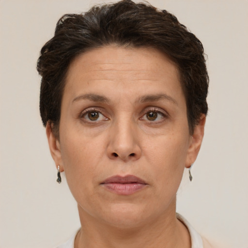 Joyful white adult female with short  brown hair and brown eyes