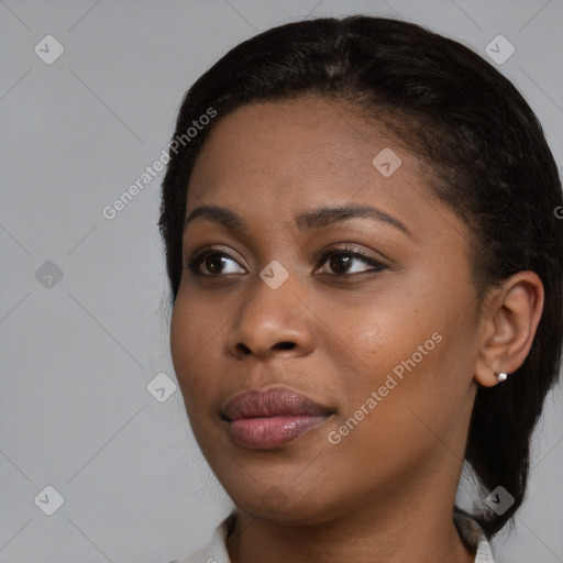 Joyful black young-adult female with medium  black hair and brown eyes