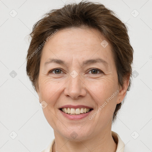 Joyful white adult female with short  brown hair and brown eyes