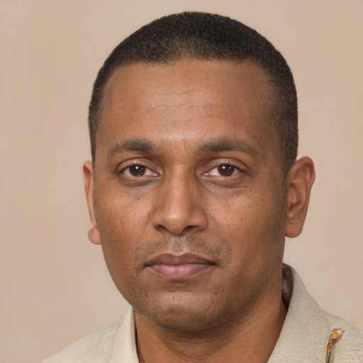 Neutral black adult male with short  black hair and brown eyes