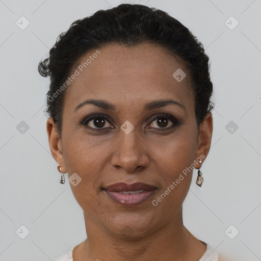 Joyful black adult female with short  brown hair and brown eyes