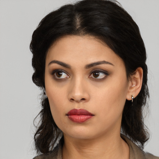 Neutral latino young-adult female with medium  black hair and brown eyes