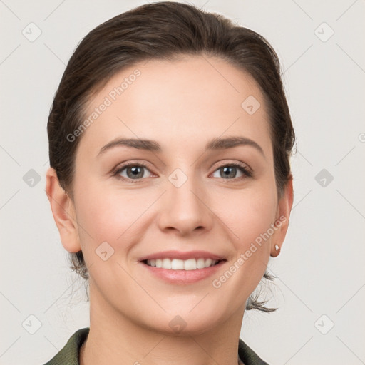 Joyful white young-adult female with medium  brown hair and grey eyes