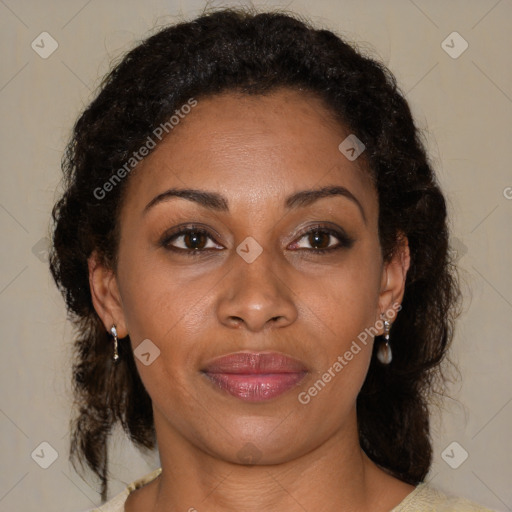 Joyful black adult female with medium  brown hair and brown eyes