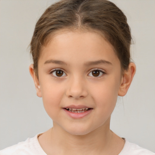 Joyful white child female with short  brown hair and brown eyes