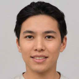 Joyful asian young-adult male with short  black hair and brown eyes