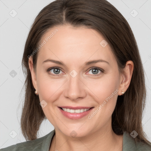 Joyful white young-adult female with medium  brown hair and grey eyes