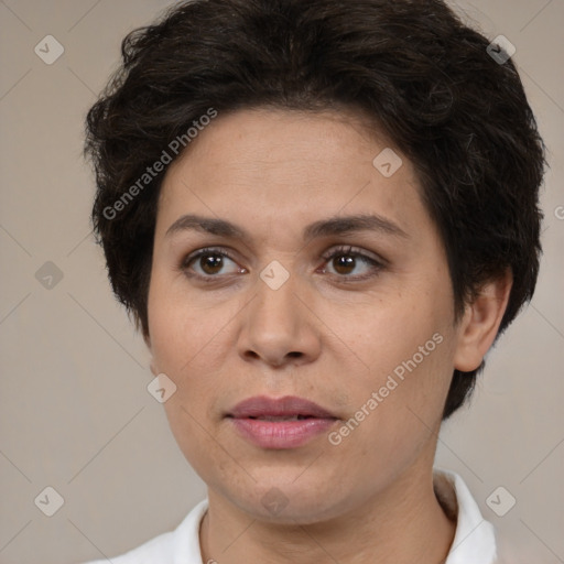 Joyful white adult female with short  brown hair and brown eyes