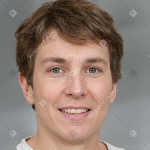 Joyful white adult male with short  brown hair and grey eyes