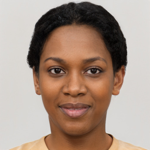 Joyful black young-adult female with short  black hair and brown eyes