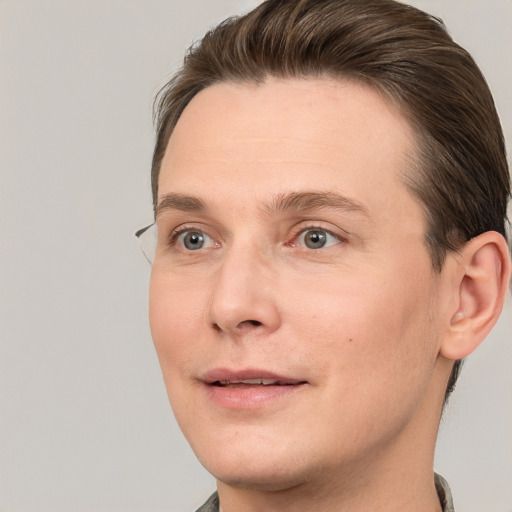 Joyful white adult male with short  brown hair and grey eyes