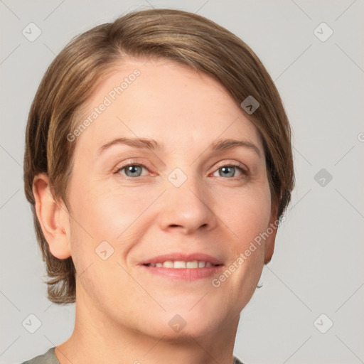 Joyful white young-adult female with short  brown hair and grey eyes