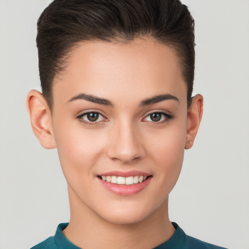 Joyful white young-adult female with short  brown hair and brown eyes