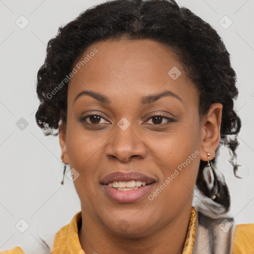 Joyful black adult female with short  brown hair and brown eyes