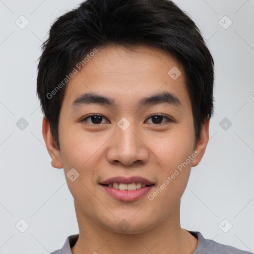 Joyful asian young-adult male with short  brown hair and brown eyes