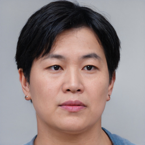 Neutral asian adult male with short  black hair and brown eyes