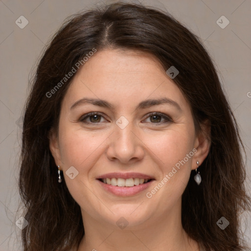 Joyful white adult female with long  brown hair and brown eyes