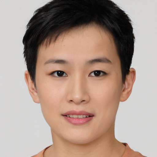 Joyful asian young-adult female with short  brown hair and brown eyes