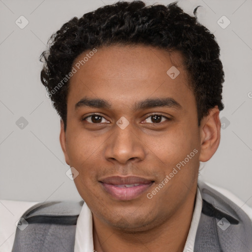 Joyful black young-adult male with short  brown hair and brown eyes